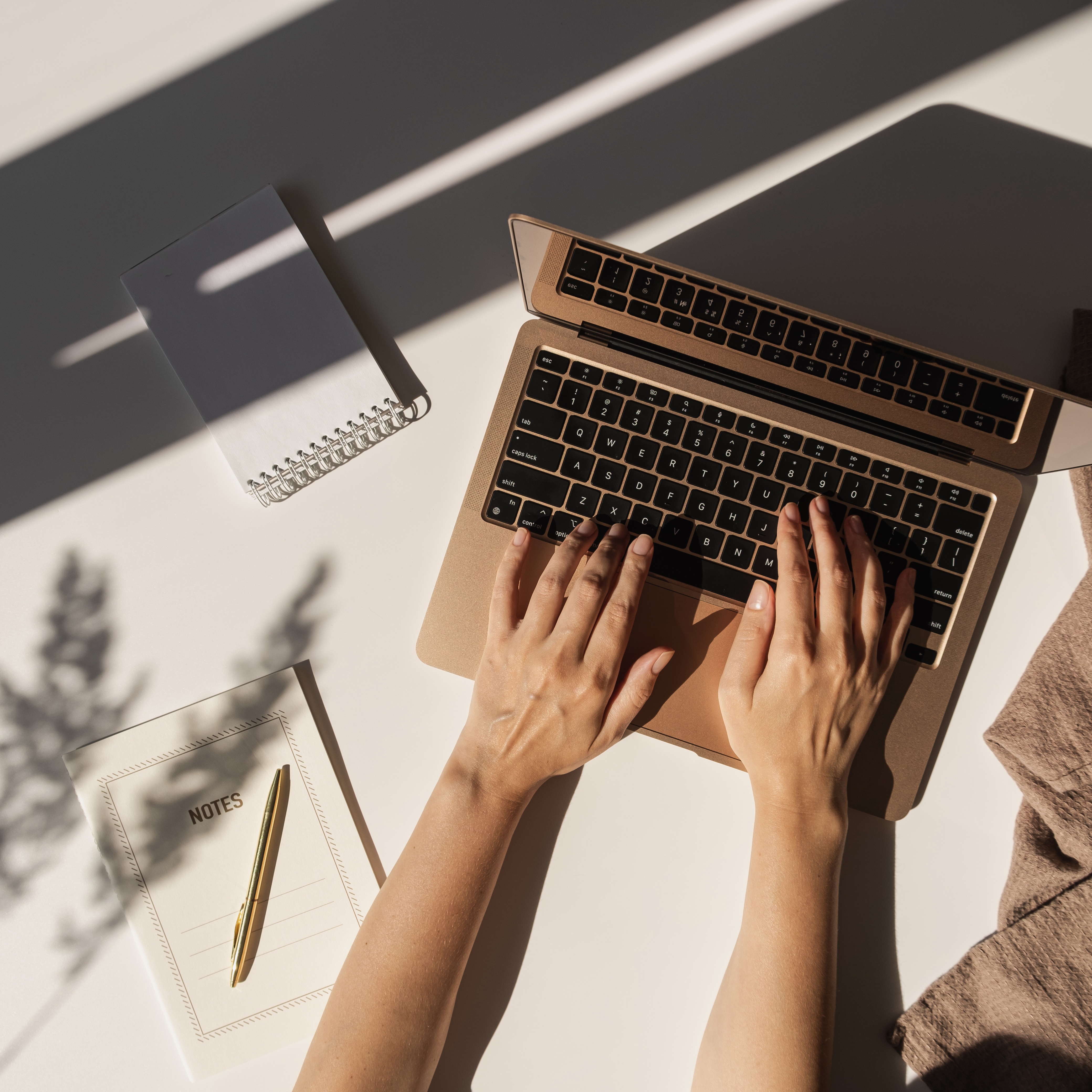Top View of Hands Typing on Laptop 